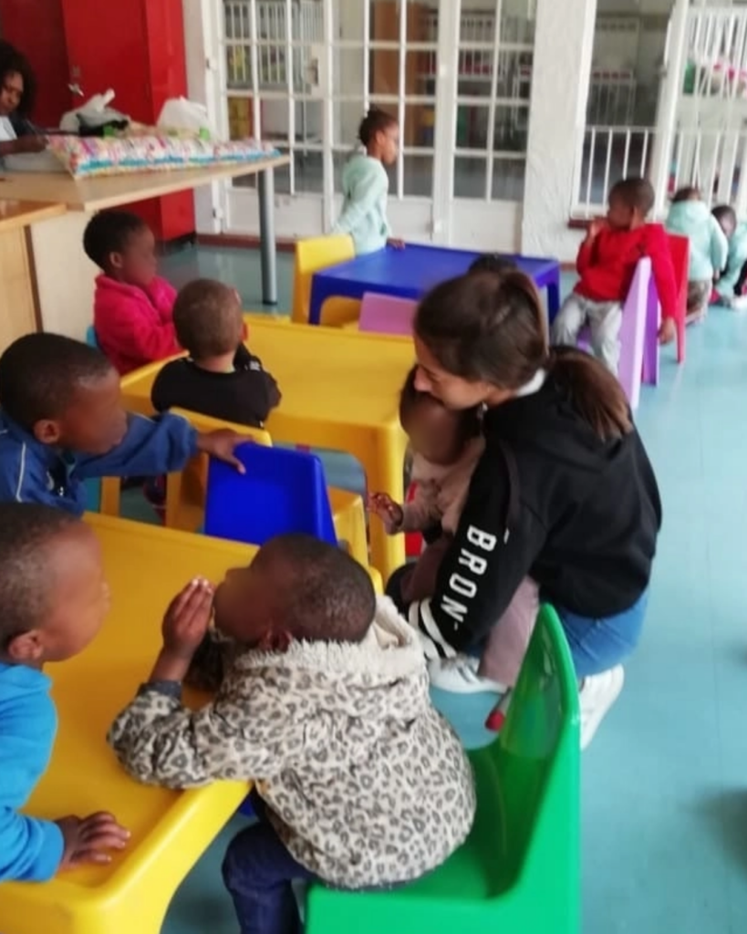 Cassandra Volunteering at a Local Orphanage During High School.
